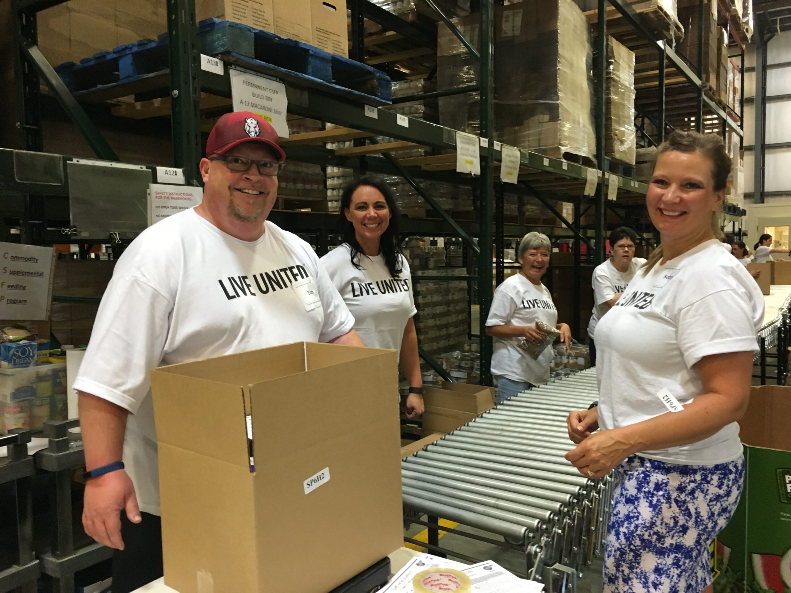 Penmac employees volunteering at food bank